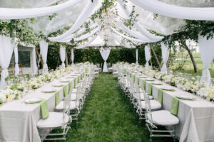 Outdoor event tent decorated with hanging fabric