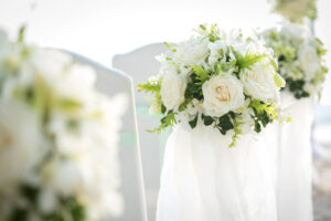 Beautiful bouquet and rental chairs in Wedding ceremony