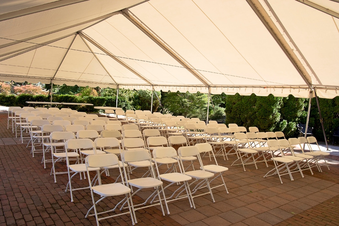 Charity event tent ceremony seating inside rental tent.