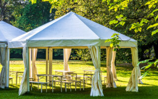 Tent Rental vs Venue: Which Is Better for Cost, Flexibility, and Experience?