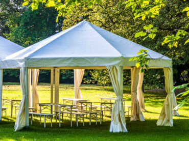 Tent Rental vs Venue: Which Is Better for Cost, Flexibility, and Experience?