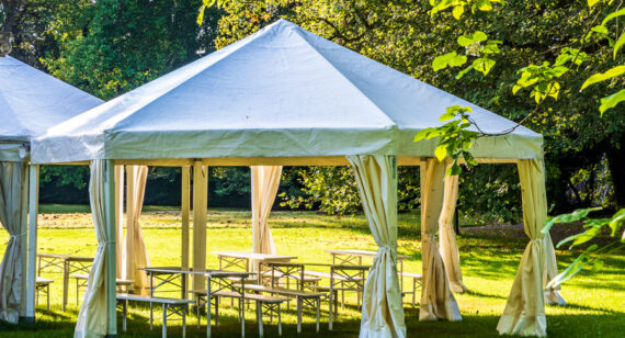 Tent Rental vs Venue: Which Is Better for Cost, Flexibility, and Experience?